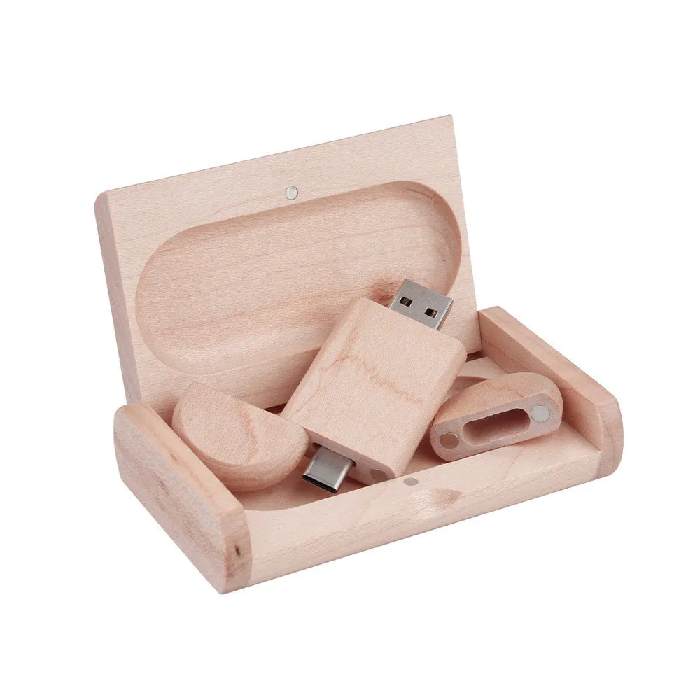 Custom engraved maple wood USB flash drive with Type-C connector for mobile phones on a wooden box.