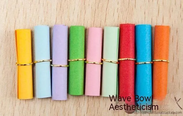 Assorted colourful mini paper scrolls with eyelets for drift bottle messages in sizes 3x7cm, 4x7cm, 7x7cm, and 5x5cm.