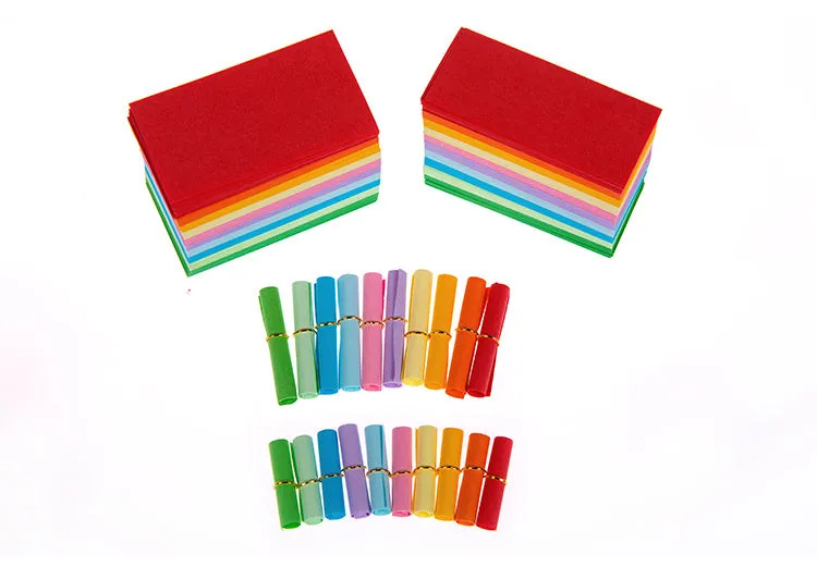 Assorted colourful mini paper scrolls with eyelets for drift bottle messages in sizes 3x7cm, 4x7cm, 7x7cm, and 5x5cm.