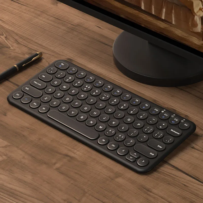 White ultra-thin wireless keyboard and mouse set on a desk, showing USB receivers and keyboard film.