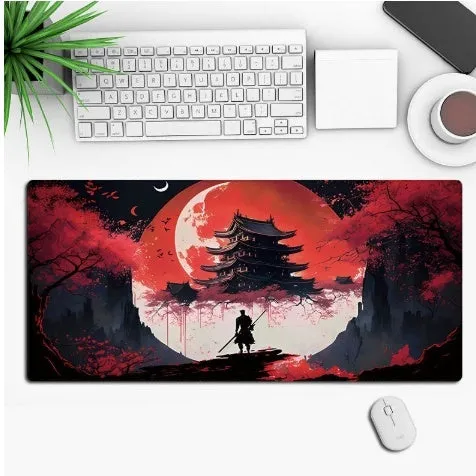 Large black anime-themed gaming mouse pad with non-slip rubber base on a wooden desk.