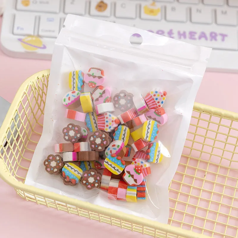 50 small colourful cartoon-themed TPR rubber erasers in a pearlescent film bag, themes include fruit, animal, and cake designs.