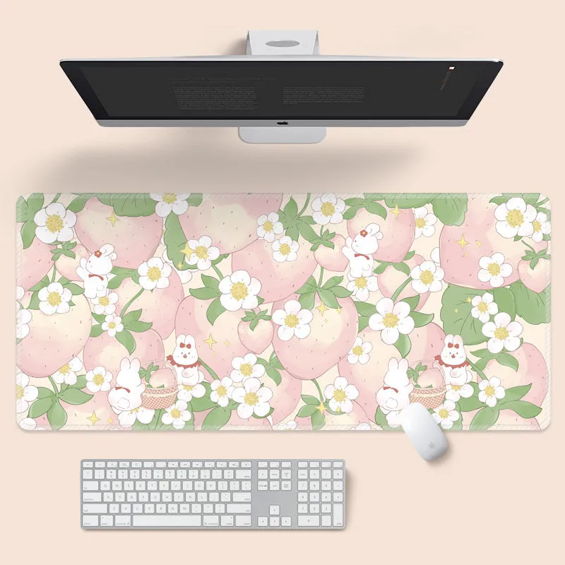 Large colourful flower pattern mouse pad on a wooden desk with keyboard and mouse.
