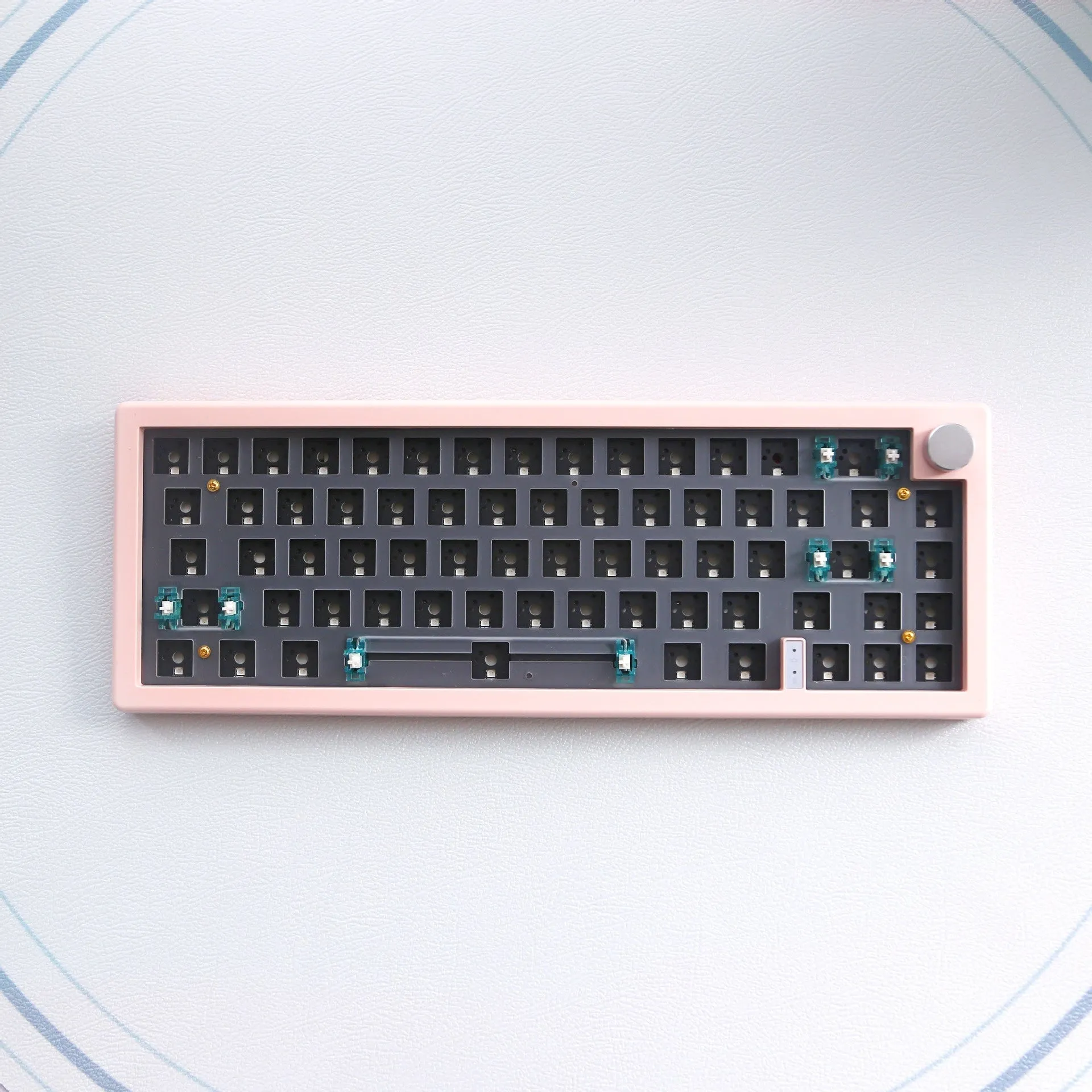 DIY mechanical keyboard kit with RGB lighting and control knob in multiple colour options