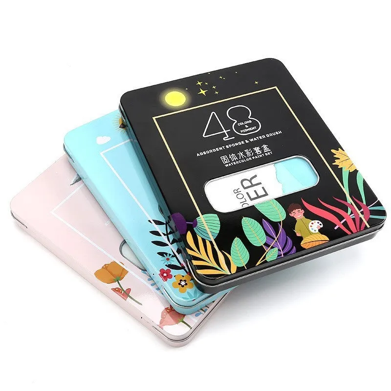 Box containing 48 solid watercolour paint cakes in various colours including black, pink, and blue.