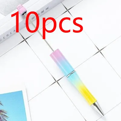 Colourful spinning ballpoint pen with plastic beads on a white background.
