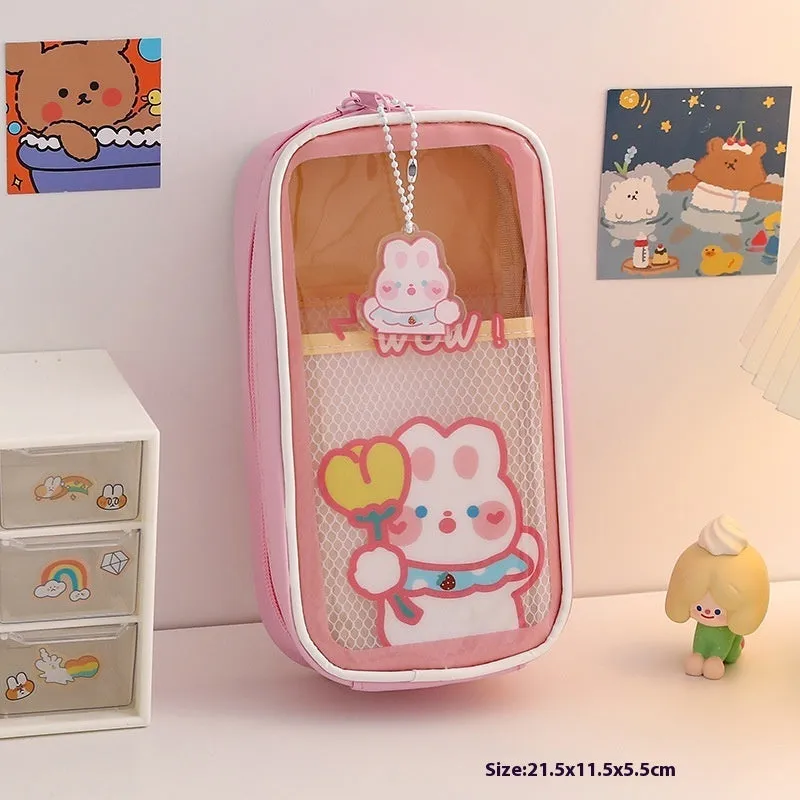 Transparent PVC pencil case with cartoon design showing pens and pencils inside