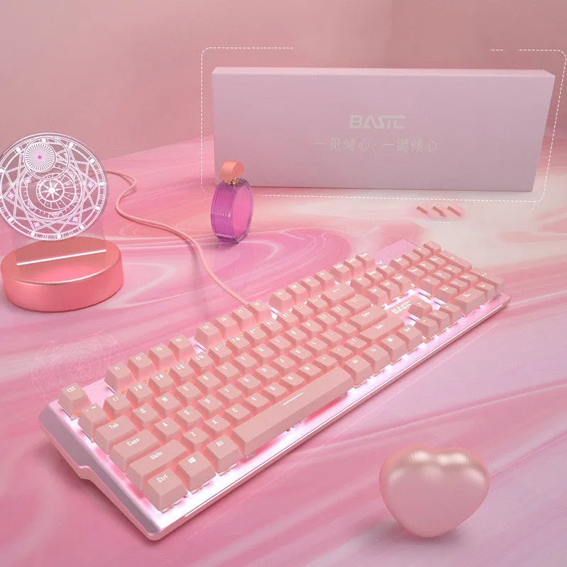 Pink wired mechanical keyboard and gaming mouse set on a desk.