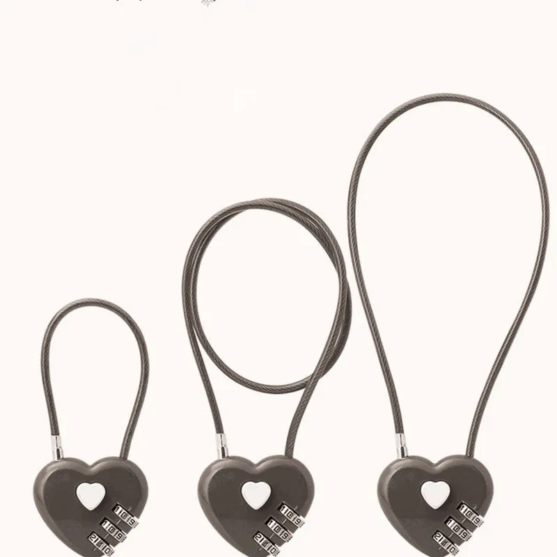 Peach Heart shaped wire rope lock in ABS plastic for securing bicycle helmets.