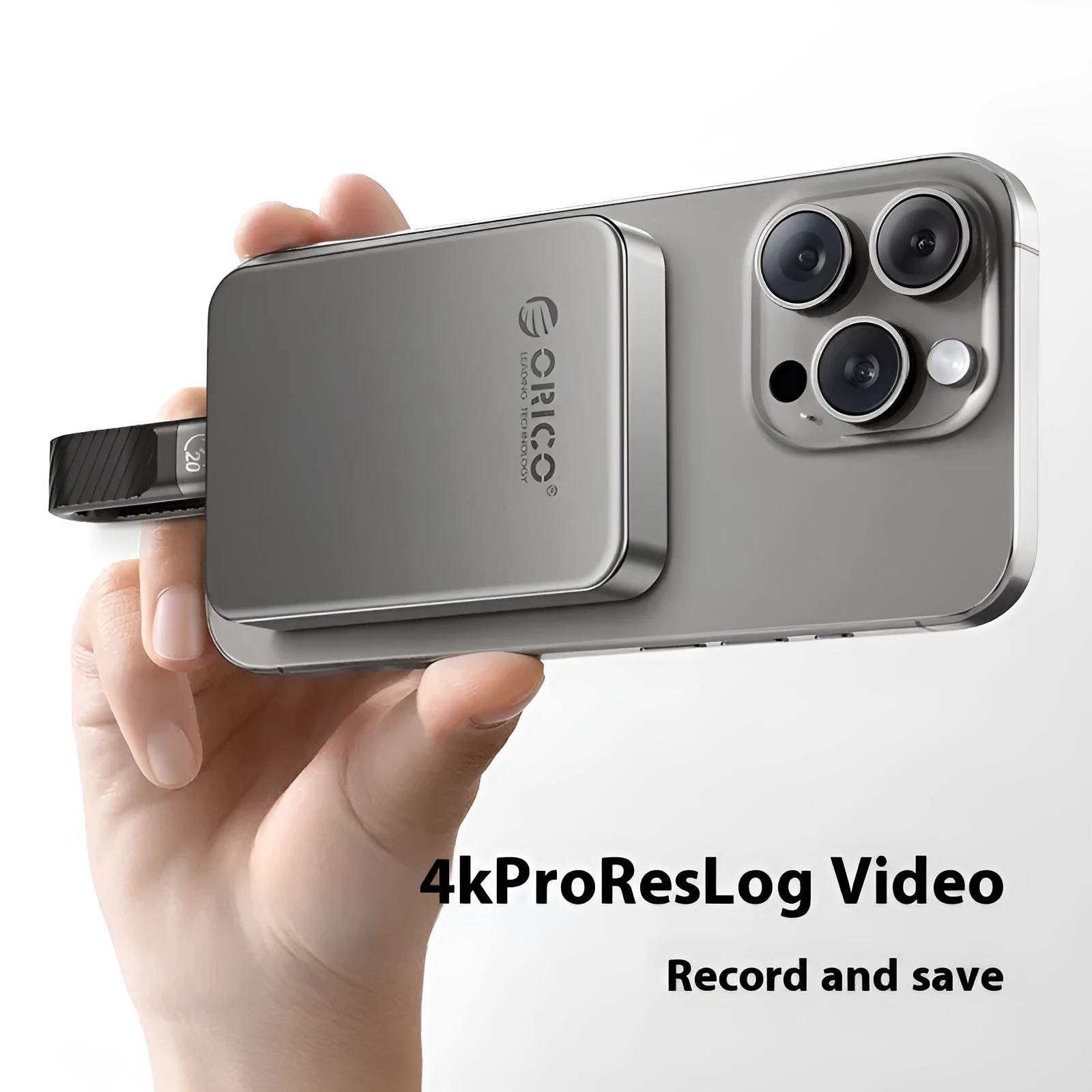 Grey magnetic mobile solid state drive with ultra-thin design next to its C to C cable and magnetic suction ring.