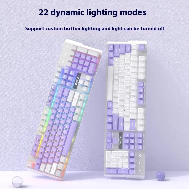 Purple and white mechanical keyboard and optical mouse set with backlighting on desktop