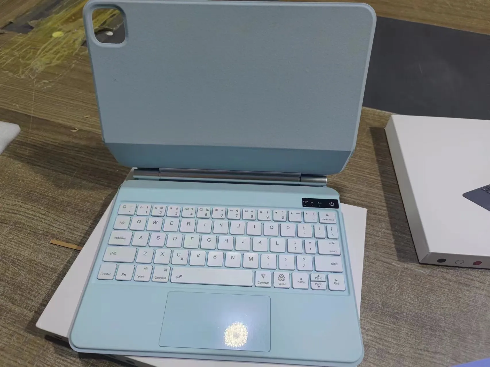 Bluetooth wireless keyboard with magnetic protective cover for iPad Pro and iPad Air tablets in various colours.