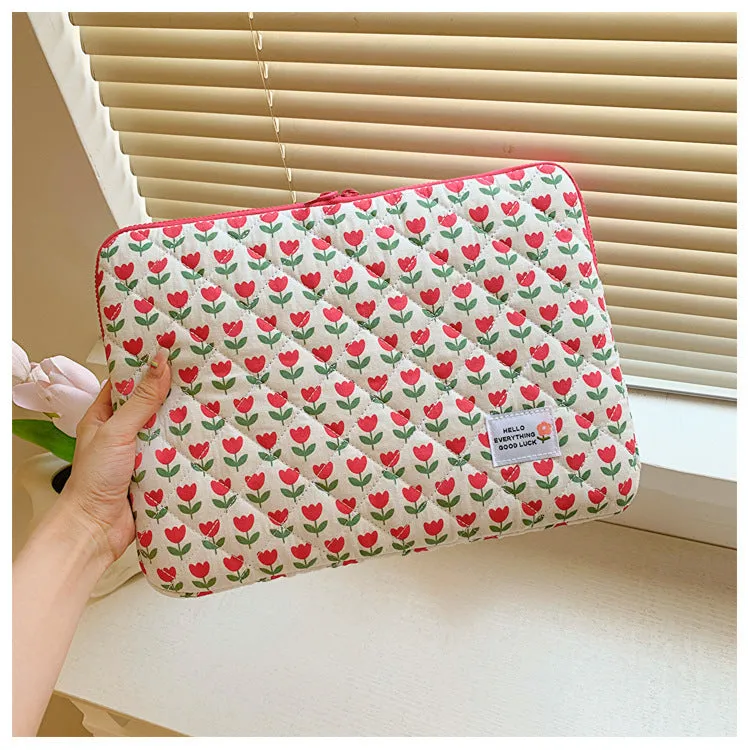 Women's printed floral cloth laptop bag shown in green flower pattern, available in small, medium, and large sizes.