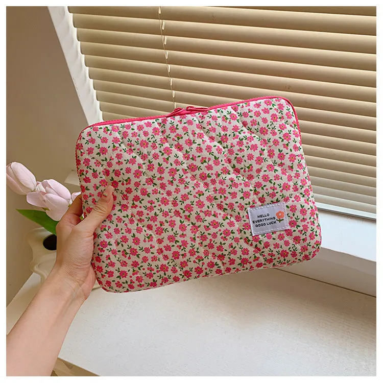 Women's printed floral cloth laptop bag shown in green flower pattern, available in small, medium, and large sizes.