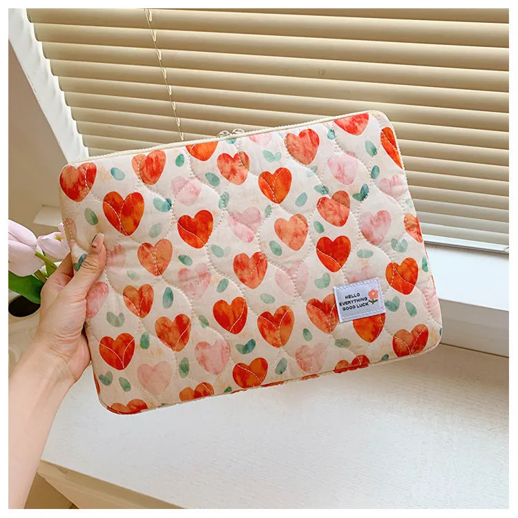 Women's printed floral cloth laptop bag shown in green flower pattern, available in small, medium, and large sizes.