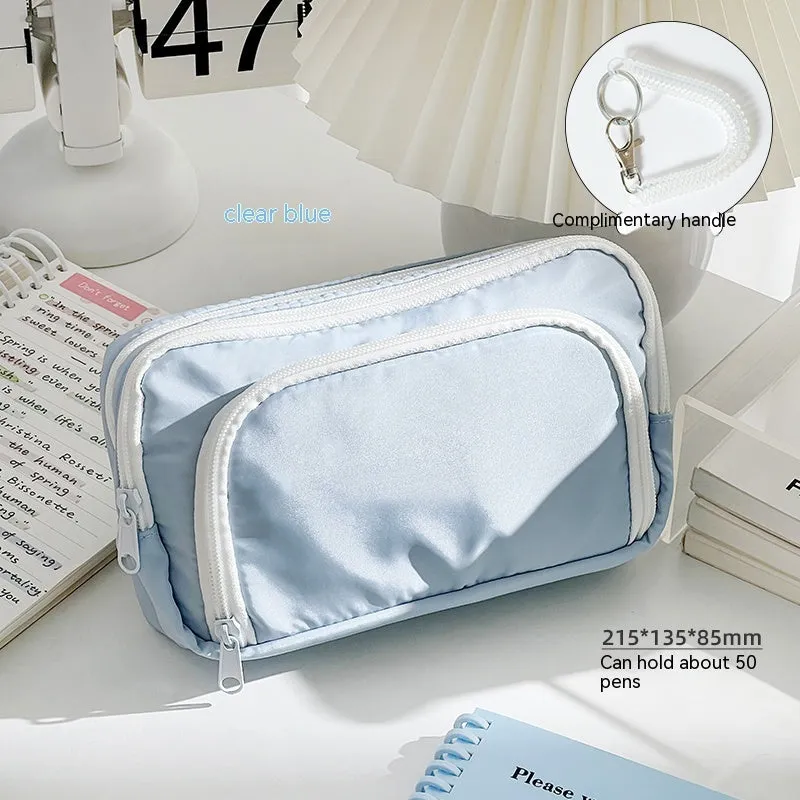 Double-layer high-capacity pencil case with carry handle in solid colour