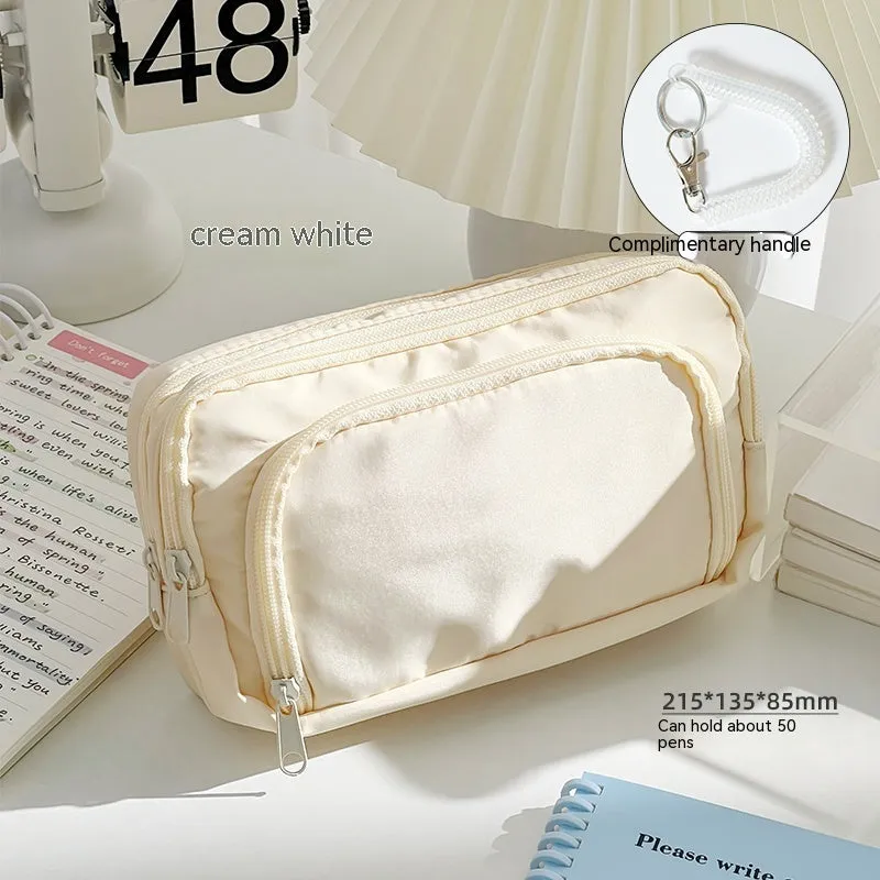 Double-layer high-capacity pencil case with carry handle in solid colour