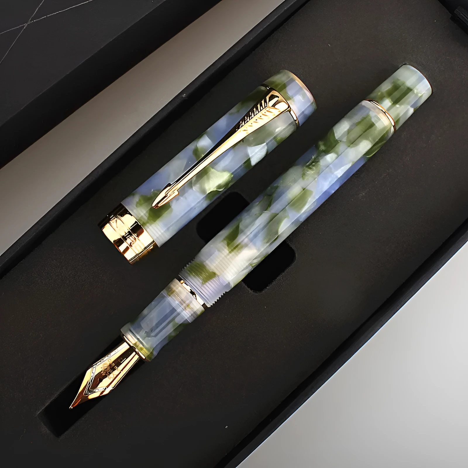 Deep bath green metal ballpoint pen showing three different tip size options