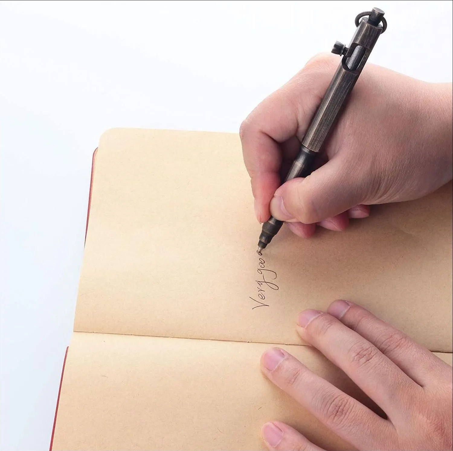 Brass tactical pen with hexagonal bolt pattern showing natural colour finish and precise machining details