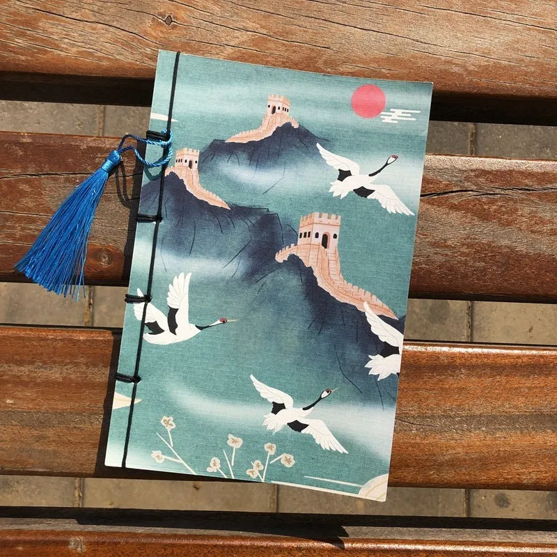 A5 antique-style wire-bound notebook with vintage Chinese painting cover, thread binding, and black wax rope tassel.