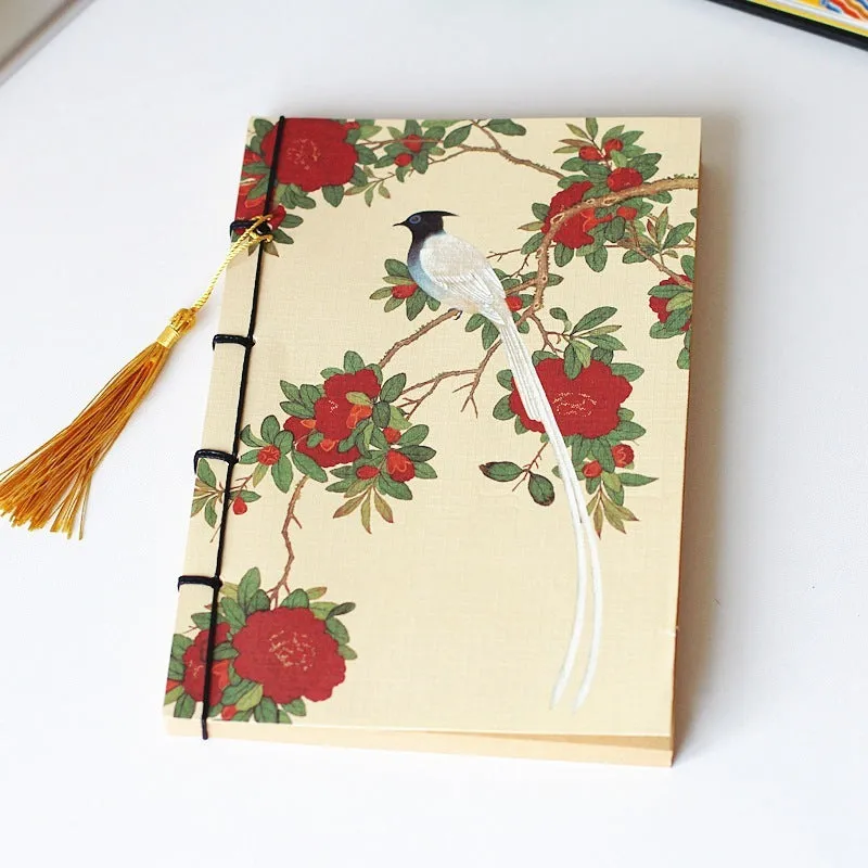 A5 antique-style wire-bound notebook with vintage Chinese painting cover, thread binding, and black wax rope tassel.
