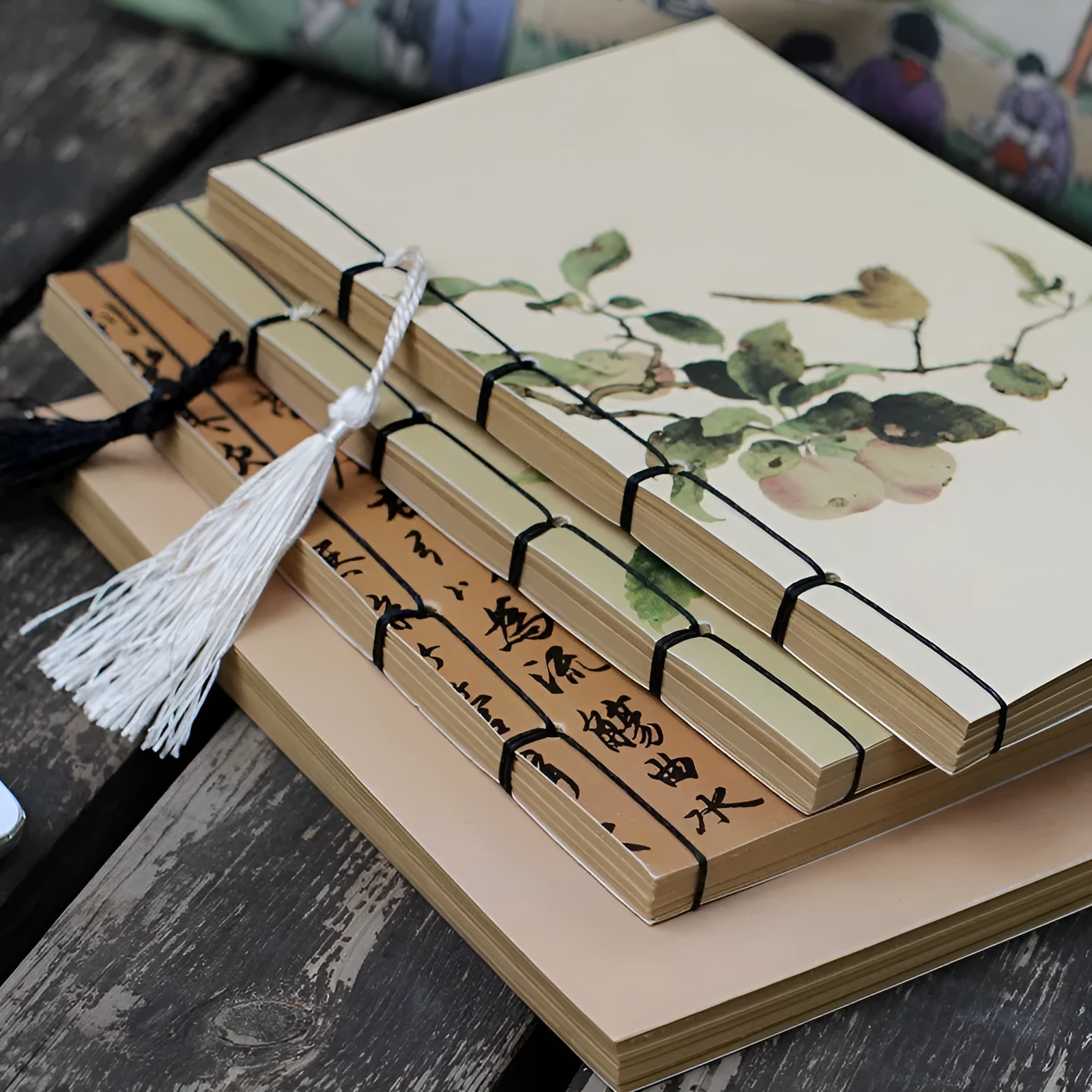 A5 antique-style wire-bound notebook with vintage Chinese painting cover, thread binding, and black wax rope tassel.