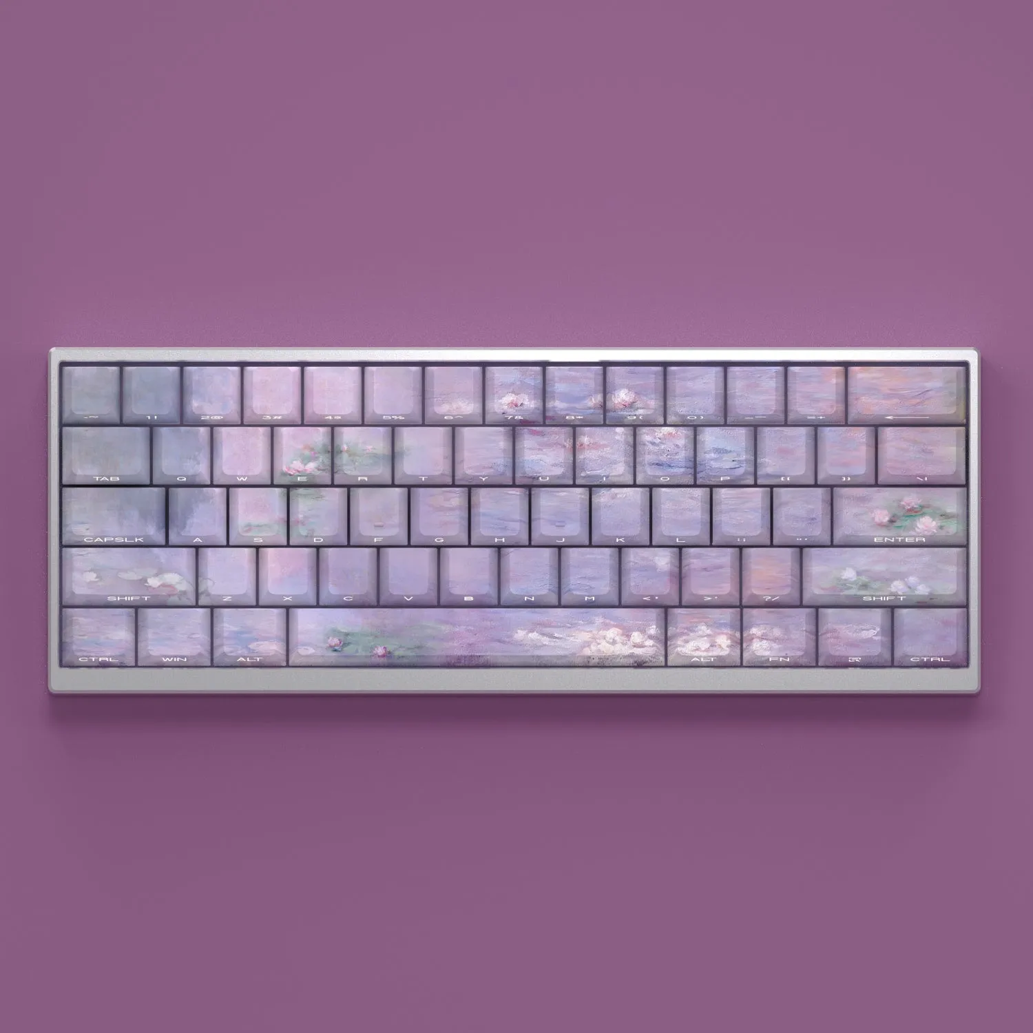 Set of white PBT keycaps with colourful water lily design on top and sides, showing side-engraved transparent characters.