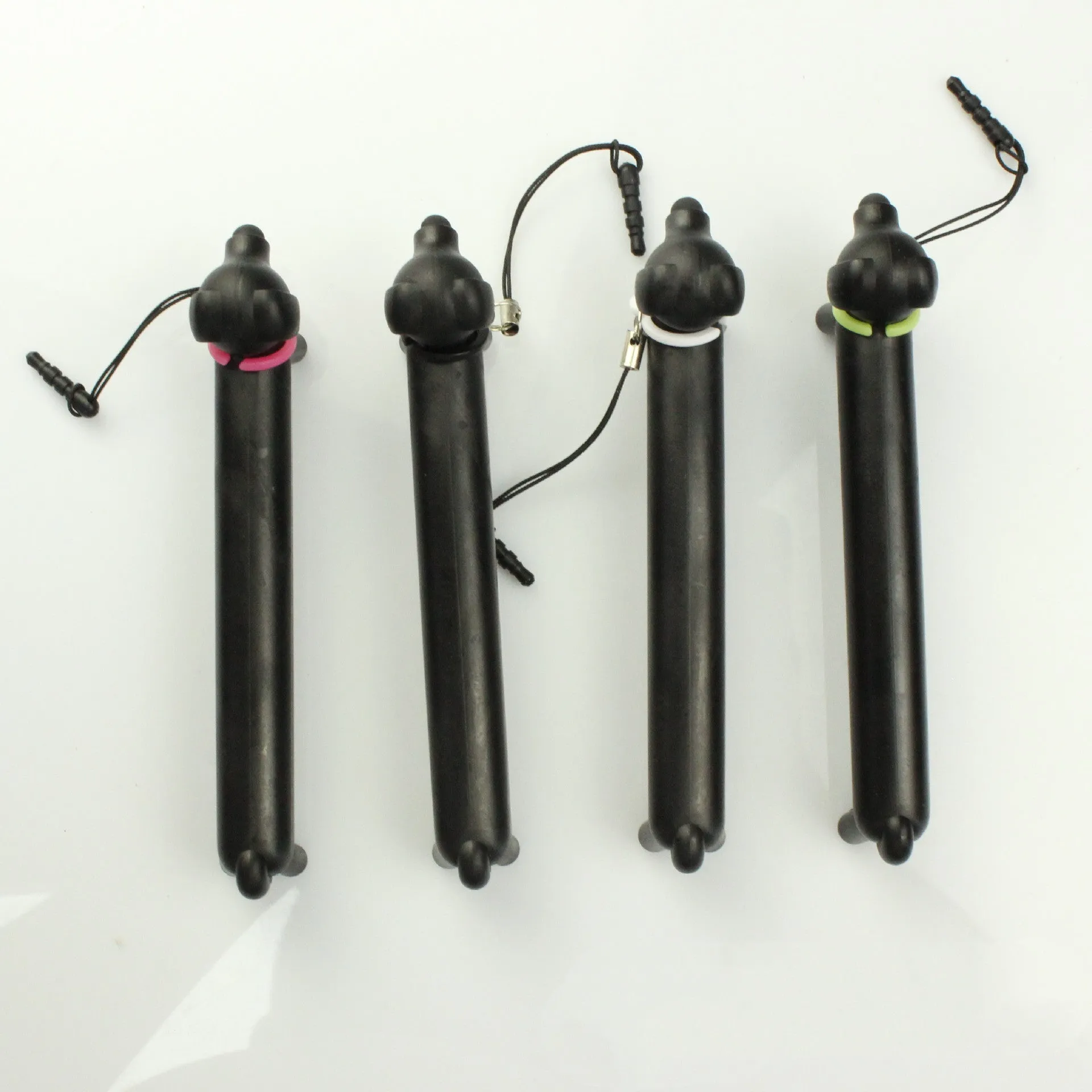 Black dog-shaped touch screen stylus with adjustable length and phone holder stand base