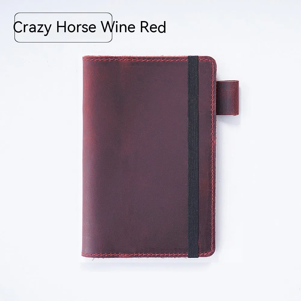 Handmade leather kraft notebook open showing wood-free paper with dark green cowhide cover