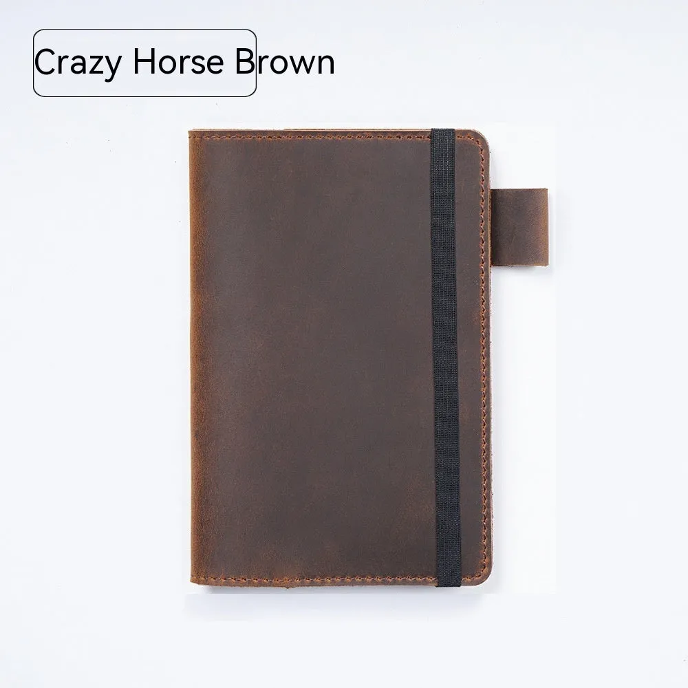 Handmade leather kraft notebook open showing wood-free paper with dark green cowhide cover