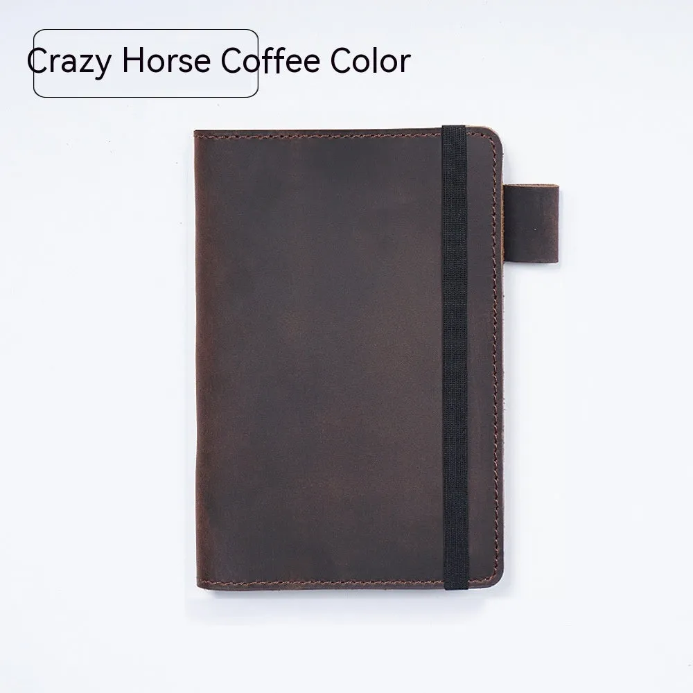 Handmade leather kraft notebook open showing wood-free paper with dark green cowhide cover