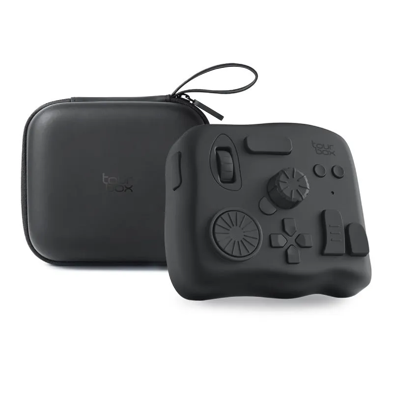 TourBox NEO black video editing controller with dials and buttons on a desk.
