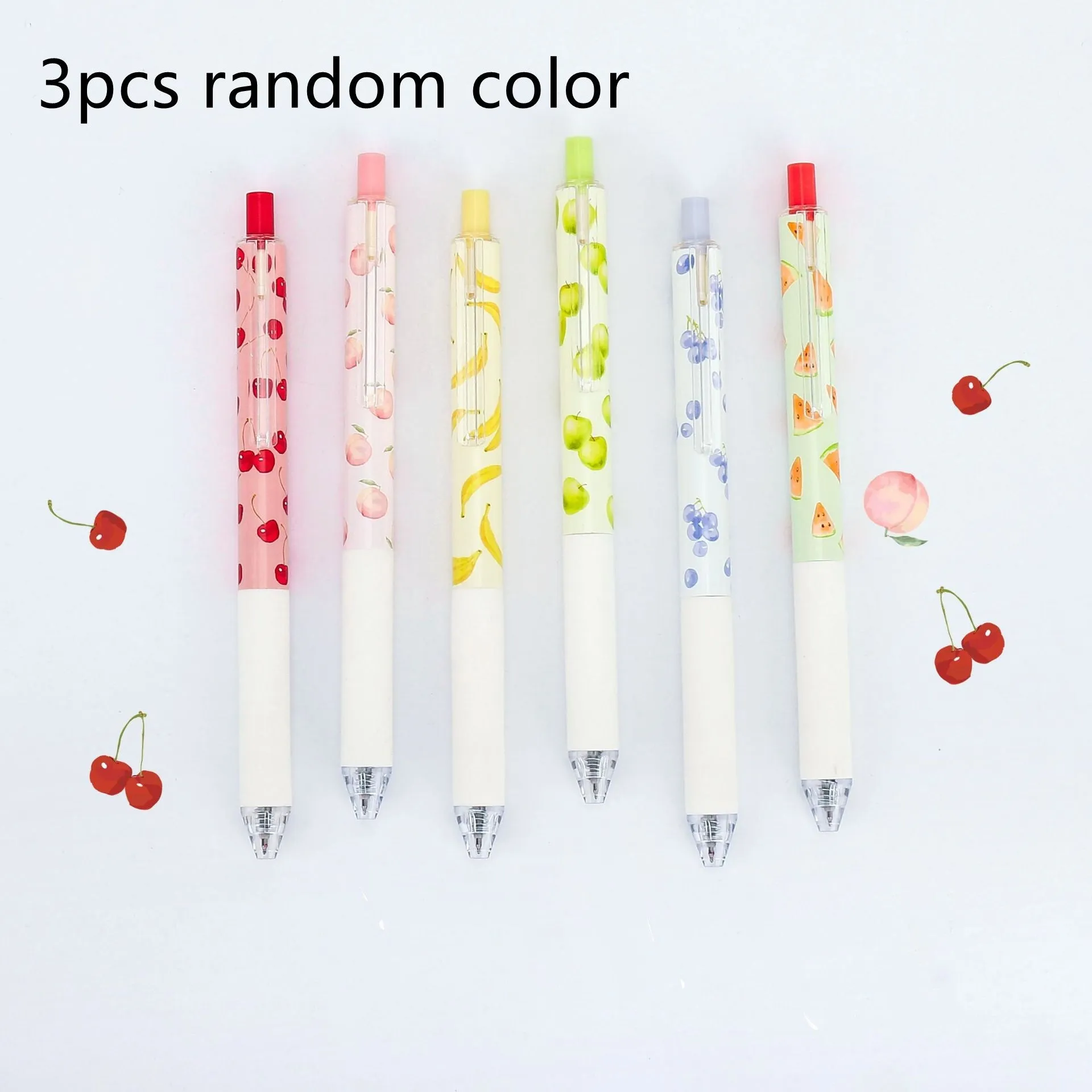 Three fruit scented press-action pens with 0.5mm quick-drying black refills on white background