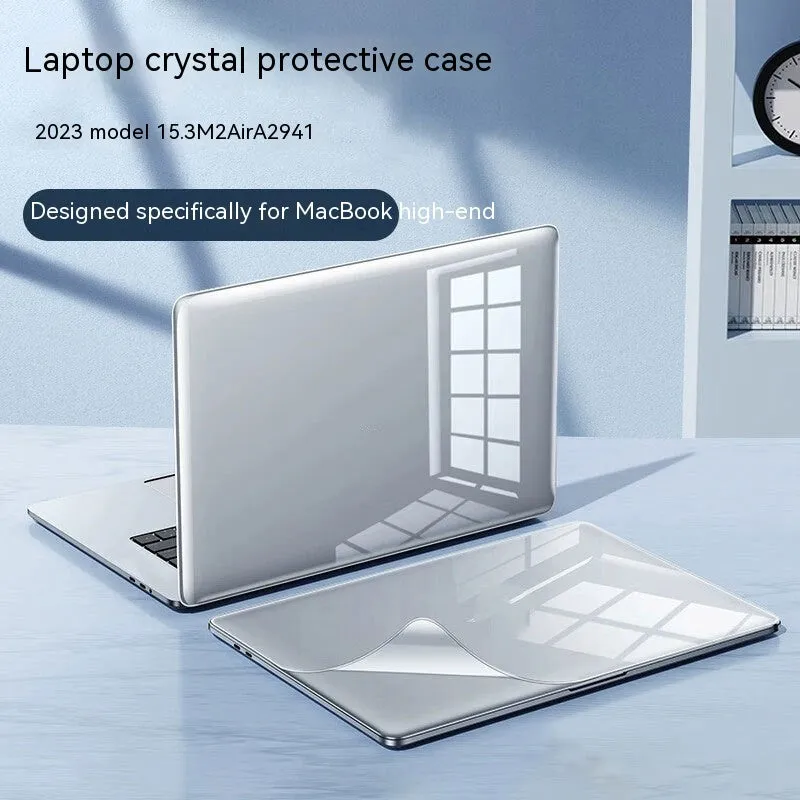 MacBook Pro laptop with a crystal transparent protective hard shell case snapped onto its lid and base.