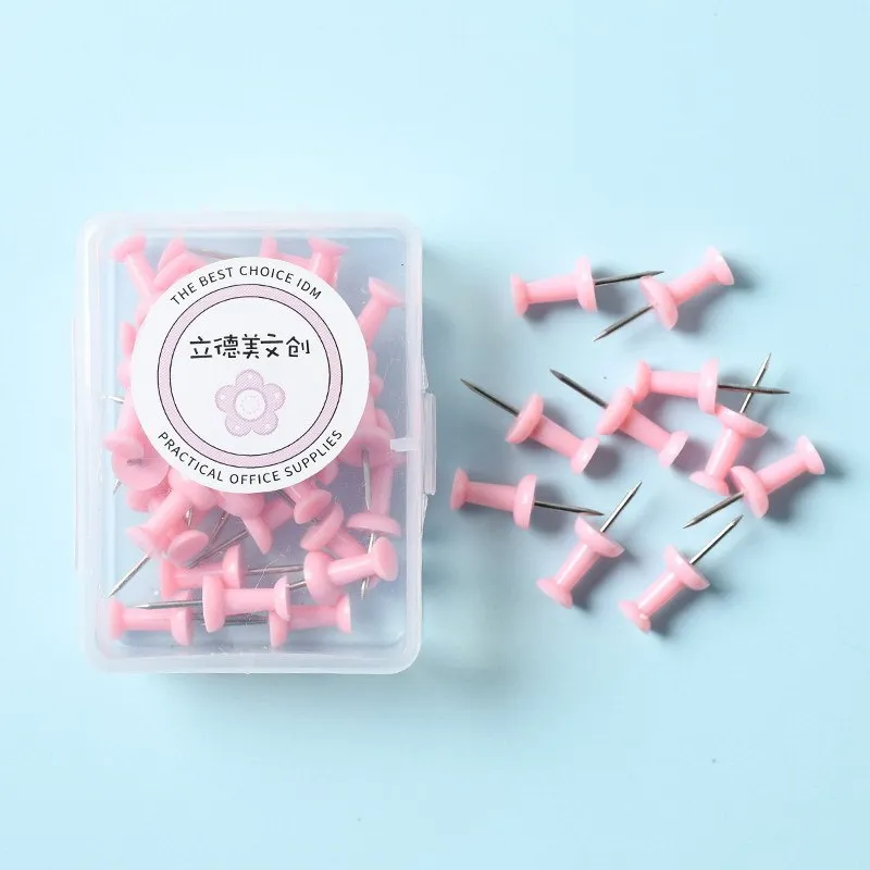 Boxed plastic push pins in macaron colours: cherry blossom pink, mint green, and lavender in large and small sizes