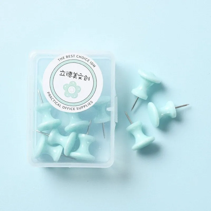Boxed plastic push pins in macaron colours: cherry blossom pink, mint green, and lavender in large and small sizes