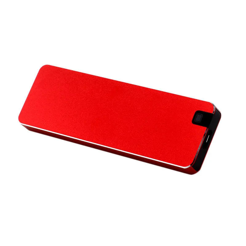 Silver portable metal-shell solid state hard drive with USB cable on a grey background.