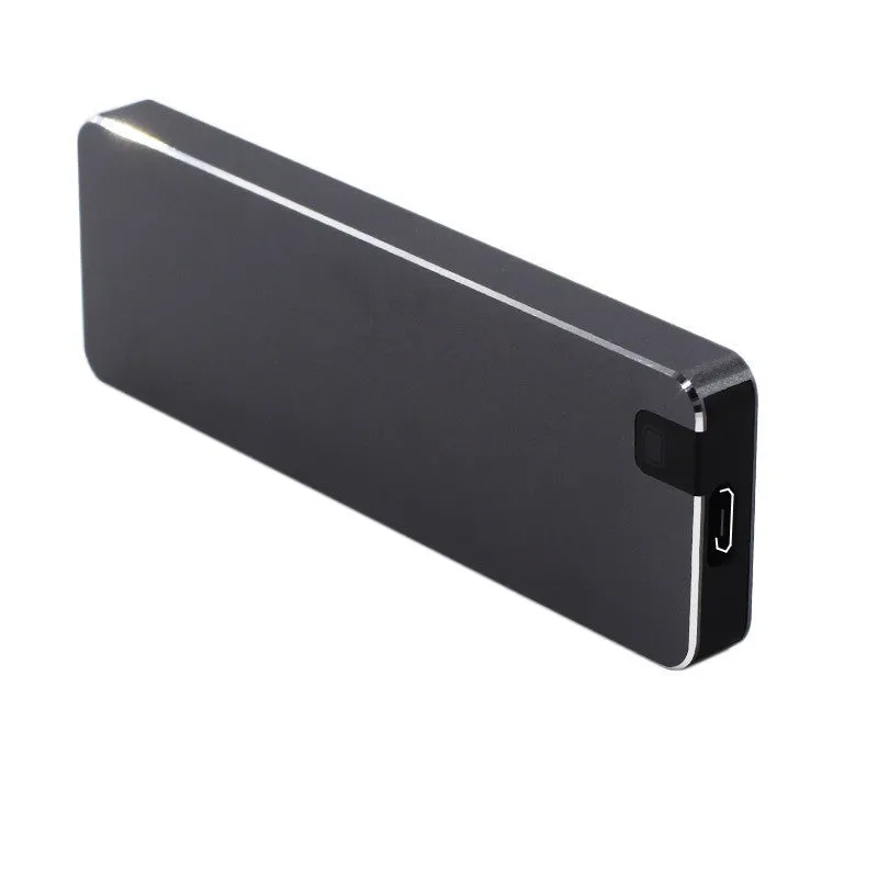 Silver portable metal-shell solid state hard drive with USB cable on a grey background.