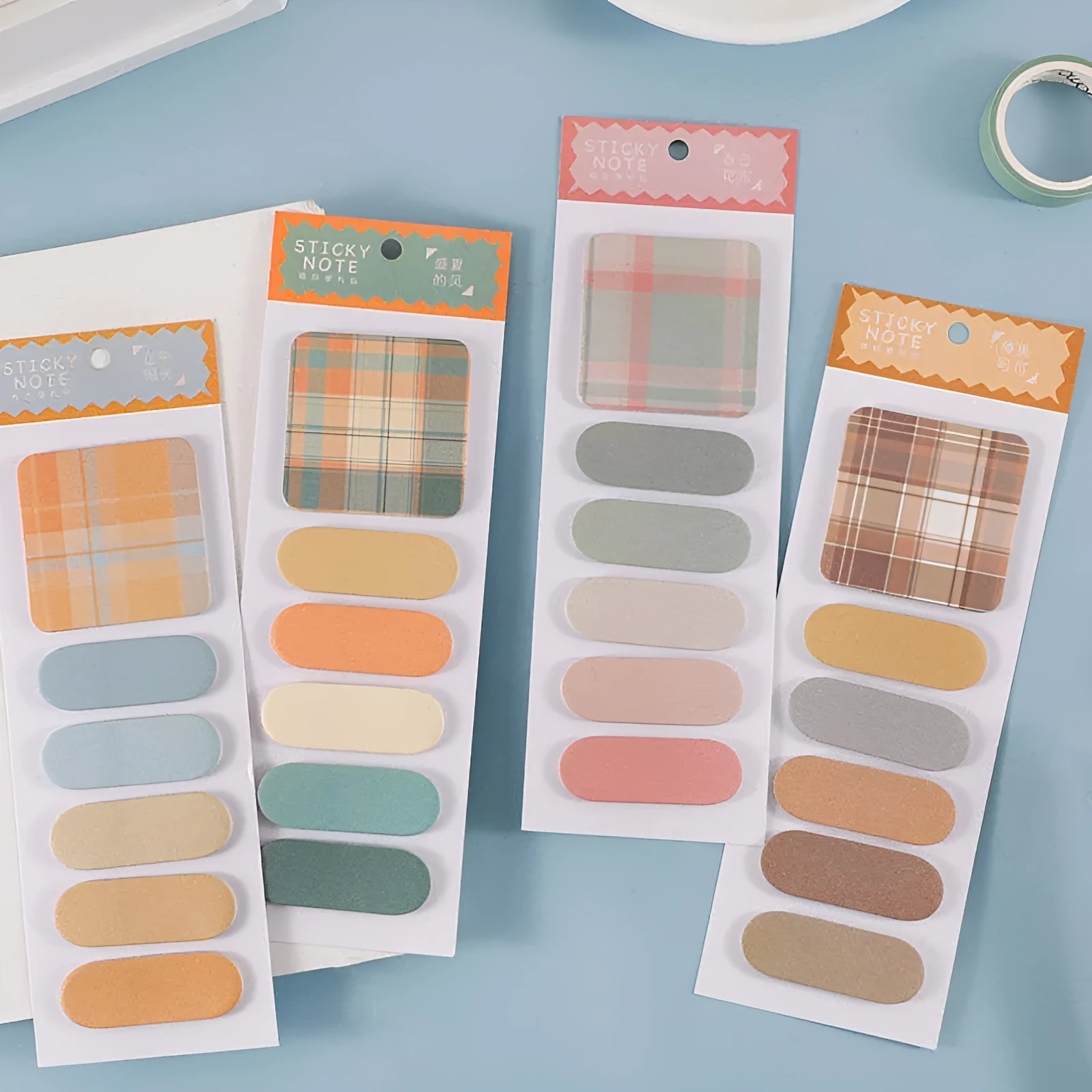Colourful plaid memo pad sticky notes pack with six designs, 120 sheets total, each sheet 67mm by 200mm.