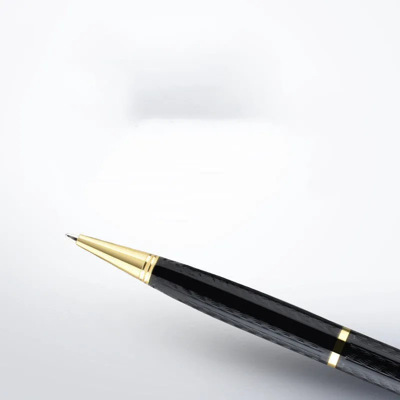 Black pen-shaped audio recorder with zinc alloy body, shown next to its included headset and data cable.
