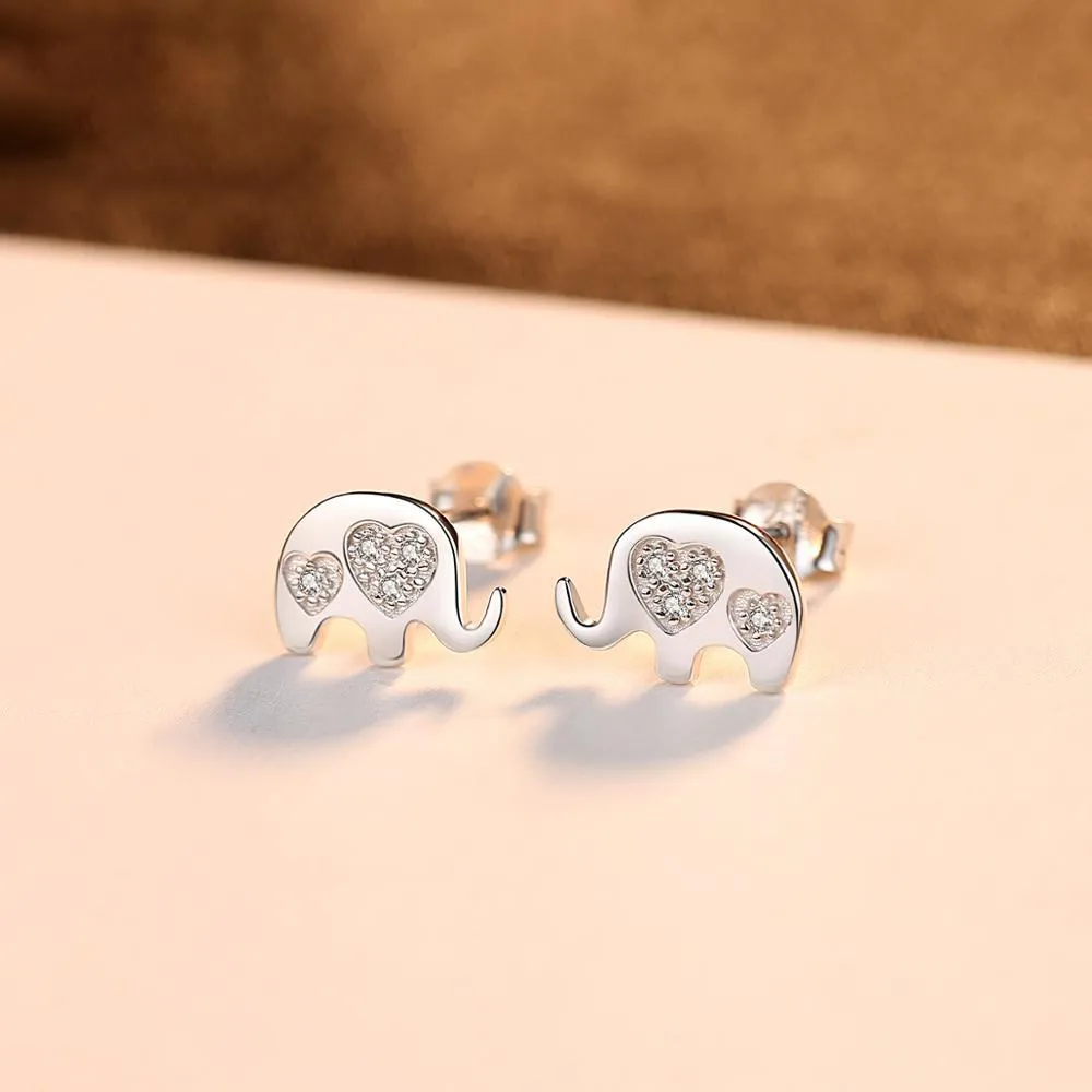 Geometric shaped silver earrings with gem setting, shown in gold and silvery finishes.