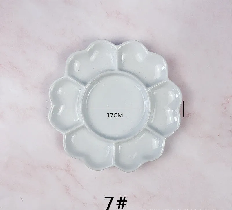 White ceramic painting palette with plum blossom design, shown in 6 inch, 7 inch, and 8 inch size options.