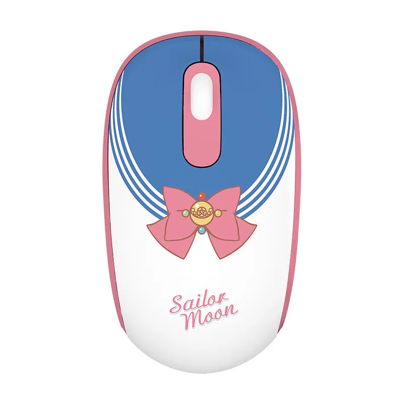 Pink Sailor Moon wireless mouse with USB receiver on a desk.
