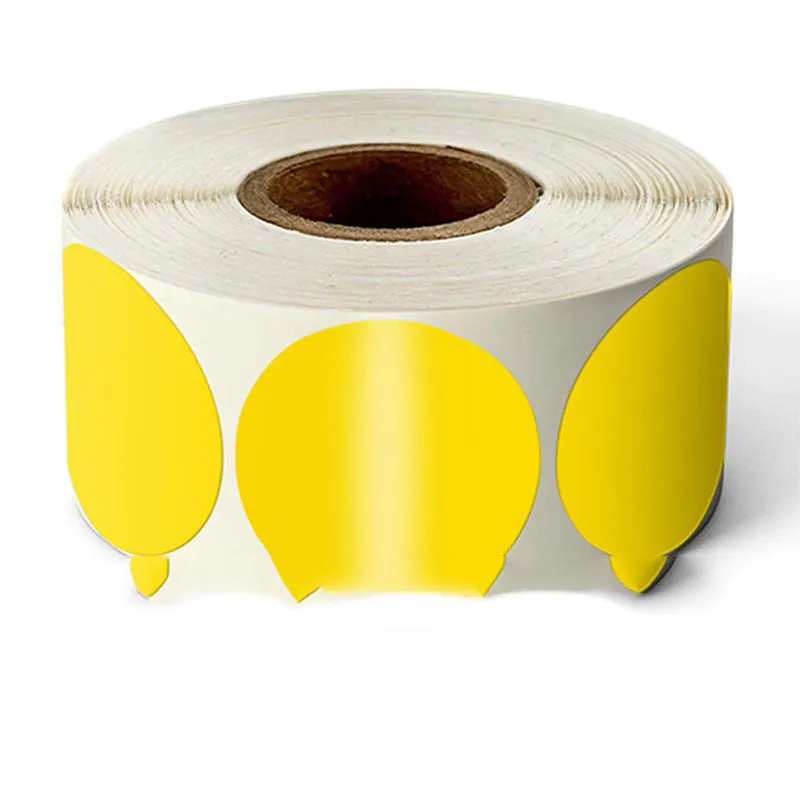 Roll of round colour marker stickers showing multiple colours including black, blue, red, yellow, and kraft paper.