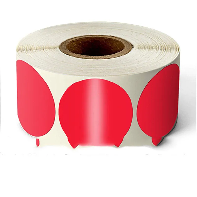 Roll of round colour marker stickers showing multiple colours including black, blue, red, yellow, and kraft paper.
