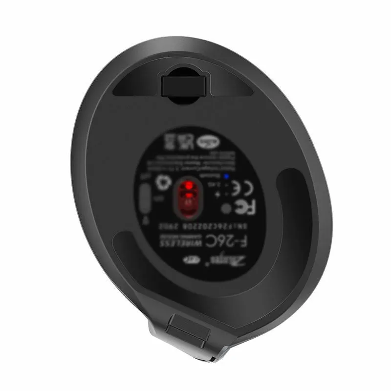 Grey vertical ergonomic Bluetooth mouse with USB charging port on a desk.