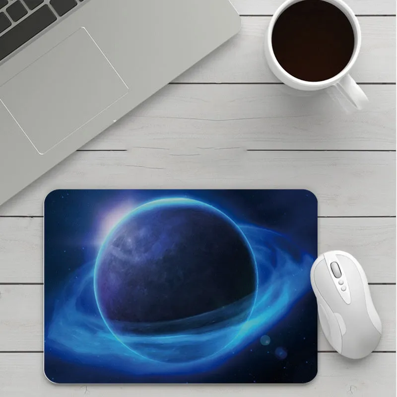 Thick custom cartoon mouse pad with colourful design on a desk, showing black seam edge