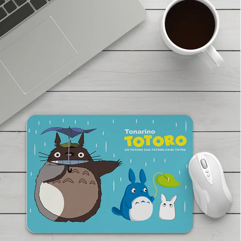 Thick custom cartoon mouse pad with colourful design on a desk, showing black seam edge