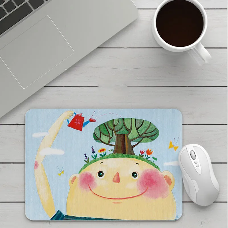 Thick custom cartoon mouse pad with colourful design on a desk, showing black seam edge