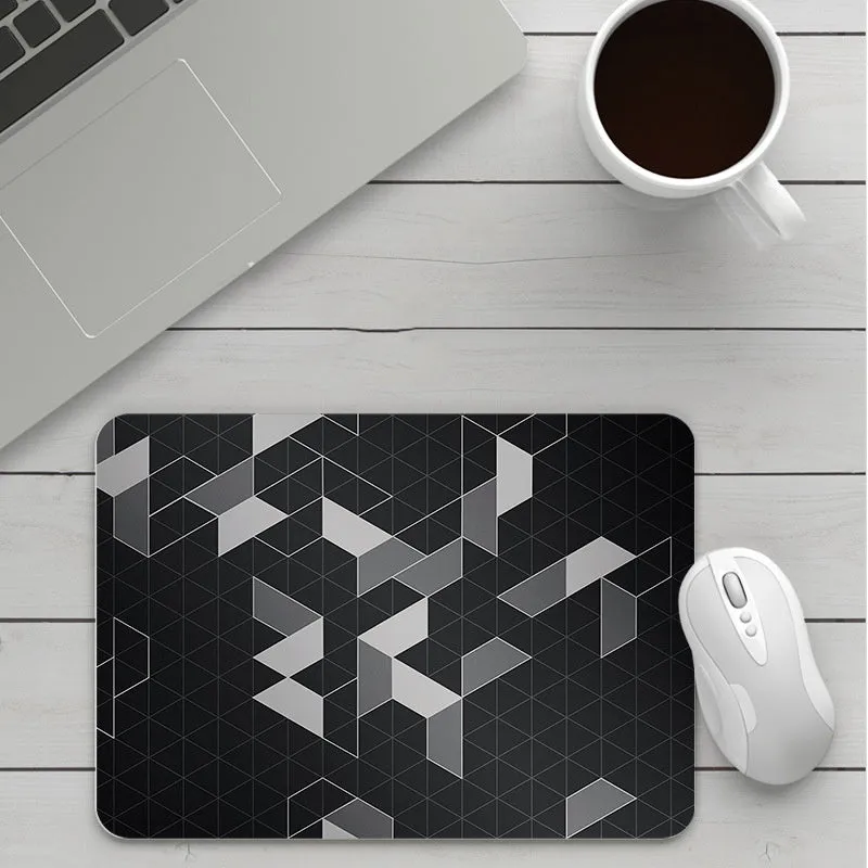 Thick custom cartoon mouse pad with colourful design on a desk, showing black seam edge